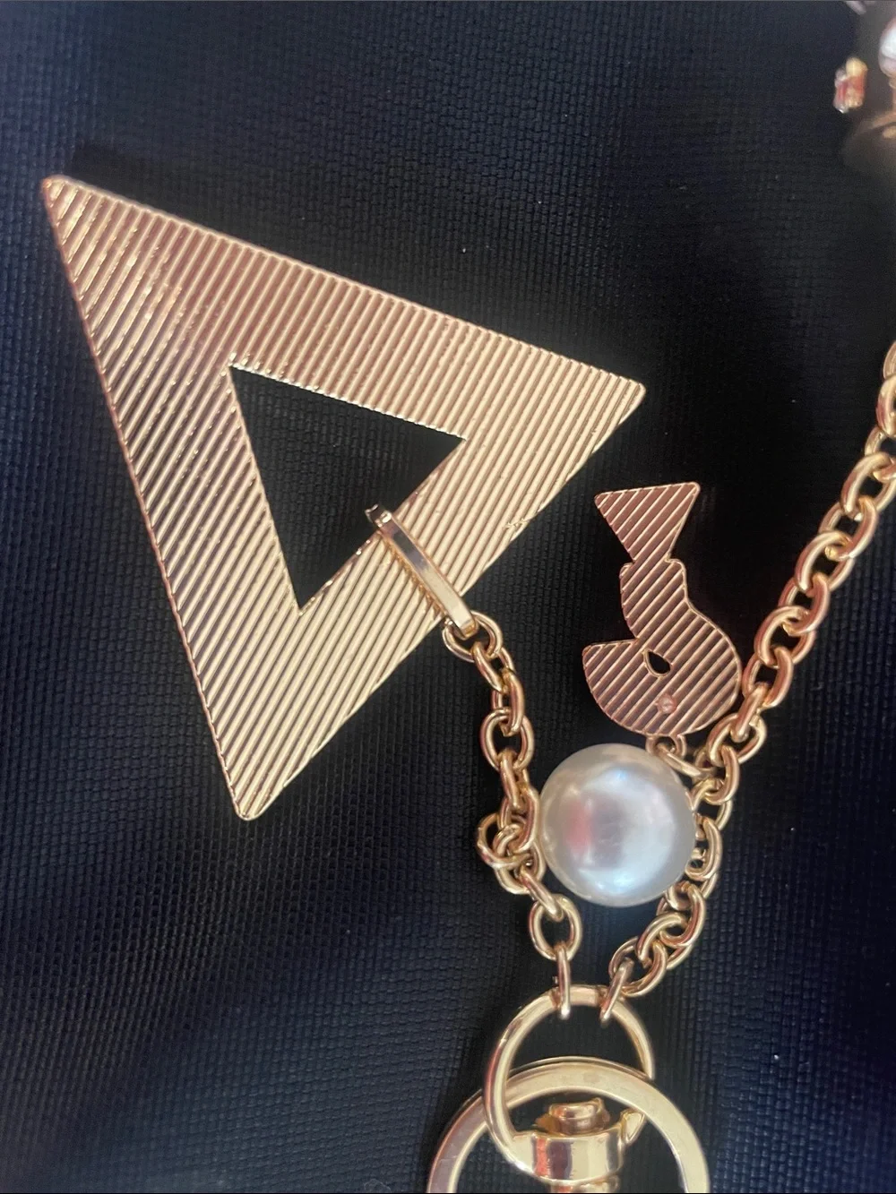 GUESS White and Gold Logo Tassel Keyring Charm